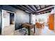 Basement area includes a chalkboard wall, foosball table, and dining area at 6051 E 160Th Pl, Brighton, CO 80602