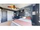 Cozy bedroom with modern decor, ceiling fan, and a dedicated workspace area at 6051 E 160Th Pl, Brighton, CO 80602