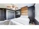 Cozy bedroom with accent wall, ceiling fan, and closet with sliding doors at 6051 E 160Th Pl, Brighton, CO 80602