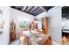Basement dining area with table, chairs, built-in display cabinets, and window at 6051 E 160Th Pl, Brighton, CO 80602
