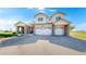 Beautiful two-story home boasting a stone accented entryway and a spacious two car garage at 6051 E 160Th Pl, Brighton, CO 80602