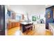Spacious kitchen with granite countertops, stainless appliances, and a breakfast bar at 6051 E 160Th Pl, Brighton, CO 80602