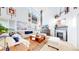 Bright and airy living room boasts soaring ceilings, fireplace, and stylish decor at 6051 E 160Th Pl, Brighton, CO 80602