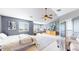 Spacious bedroom with plush carpet, stylish furniture, and large windows at 6051 E 160Th Pl, Brighton, CO 80602
