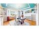 Bright office with a large window, unique ceiling, hardwood floors and modern decor at 6051 E 160Th Pl, Brighton, CO 80602