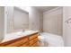 Bathroom with tile flooring, wood vanity, and a shower-tub combo, perfect for relaxation at 2503 N Ogden St, Denver, CO 80205