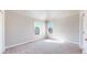 Bedroom with vaulted ceiling, carpeted floor, and large windows offering bright, natural light at 2503 N Ogden St, Denver, CO 80205