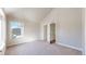 Bedroom with vaulted ceiling, carpeted floor, and two doorways, providing a spacious feel at 2503 N Ogden St, Denver, CO 80205