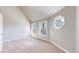 Bedroom featuring a vaulted ceiling, carpeted floor, and uniquely shaped windows at 2503 N Ogden St, Denver, CO 80205