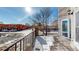 Deck with metal railings overlooking residential street at 2503 N Ogden St, Denver, CO 80205