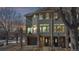 Exterior of the home showing a front-facing garage, a balcony, and two front doors at 2503 N Ogden St, Denver, CO 80205