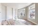 Sun-filled living area featuring built-in shelving and large windows with neighborhood views at 2503 N Ogden St, Denver, CO 80205