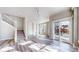 Open-concept living room with stairway, sleek flooring, built-in shelving, and natural light at 2503 N Ogden St, Denver, CO 80205