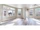 Bright living room featuring large windows, sleek flooring, and neutral wall tones at 2503 N Ogden St, Denver, CO 80205