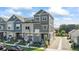 Attractive modern townhome with gray siding, professional landscaping, and a welcoming front porch at 1530 Terry St, Longmont, CO 80501