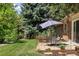 Relaxing backyard view with patio, seating, and lush landscaping at 4810 W 102Nd Pl, Westminster, CO 80031