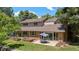 The home's backyard features a brick exterior with patio and sliding glass doors at 4810 W 102Nd Pl, Westminster, CO 80031