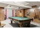 Basement with a pool table and wood paneled walls, creating a rec room at 4810 W 102Nd Pl, Westminster, CO 80031