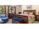 Bedroom featuring a decorative wooden frame bed, matching dressers, and bright natural light at 4810 W 102Nd Pl, Westminster, CO 80031