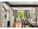 Bright dining area with hardwood floors and large windows overlooking the backyard at 4810 W 102Nd Pl, Westminster, CO 80031