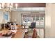 Dining area with hardwood floors, and view into adjacent living area at 4810 W 102Nd Pl, Westminster, CO 80031