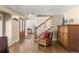Inviting foyer with hardwood floors, a staircase, and classic decor at 4810 W 102Nd Pl, Westminster, CO 80031