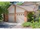 Spacious three-car garage with well-maintained doors and landscaping at 4810 W 102Nd Pl, Westminster, CO 80031