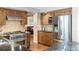 Modern kitchen with stainless steel appliances and warm wood cabinetry at 4810 W 102Nd Pl, Westminster, CO 80031