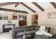 Living room view into kitchen with wet bar and stainless steel appliances at 4810 W 102Nd Pl, Westminster, CO 80031