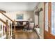 Cozy living room with hardwood floors, a leather sofa, and a decorative fireplace at 4810 W 102Nd Pl, Westminster, CO 80031