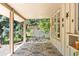 Covered patio with decorative floor, view of trees, and star decorations at 4810 W 102Nd Pl, Westminster, CO 80031