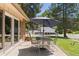 Patio with an umbrella covered table and chairs, ideal for outdoor dining at 4810 W 102Nd Pl, Westminster, CO 80031