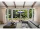 Living room with sliding glass doors to patio and outdoor dining area at 4810 W 102Nd Pl, Westminster, CO 80031