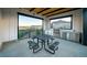 Outdoor kitchen with stainless steel appliances and picnic table at 7255 Prairie Sage Pl, Littleton, CO 80125