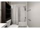 Bathroom featuring a tub with shower head and shelves at 2271 Coronado N Pkwy # D, Denver, CO 80229