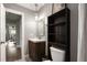 This bathroom has a sink and dark wooden cabinet at 2271 Coronado N Pkwy # D, Denver, CO 80229