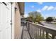 Wooden deck showcasing the exterior of the house, overlooking the street and parking area at 2271 Coronado N Pkwy # D, Denver, CO 80229