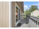 An outdoor deck is shown, including gray railing and siding, overlooking neighboring houses at 2271 Coronado N Pkwy # D, Denver, CO 80229