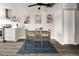 Bright dining area showcasing modern decor, wall art, and hardwood floors at 2271 Coronado N Pkwy # D, Denver, CO 80229