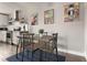 Cozy dining area featuring unique art, a wooden table, and seating for four at 2271 Coronado N Pkwy # D, Denver, CO 80229