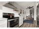 Well-appointed kitchen adjacent to a dining area, featuring stainless steel appliances and lots of light at 2271 Coronado N Pkwy # D, Denver, CO 80229