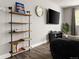 Living area featuring custom shelving and comfortable lounging options at 2271 Coronado N Pkwy # D, Denver, CO 80229