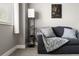 Bright room with a comfortable sofa, lamp, and a view at 2271 Coronado N Pkwy # D, Denver, CO 80229