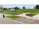 Well-maintained community park featuring shaded picnic spots, decorative features, and pedestrian access at 2271 Coronado N Pkwy # D, Denver, CO 80229