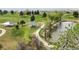 Picturesque park featuring manicured lawns, shaded picnic areas, and paved paths along the community lake at 2271 Coronado N Pkwy # D, Denver, CO 80229