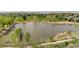 Scenic view of a community pond, surrounded by lush greenery and walking paths in a landscaped neighborhood at 2271 Coronado N Pkwy # D, Denver, CO 80229