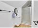 Modern bathroom featuring a glass shower and a sleek, round mirror at 2725 S Monroe St, Denver, CO 80210
