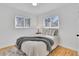 Bright bedroom features stylish decor, comfortable bed, and ample natural light at 2725 S Monroe St, Denver, CO 80210