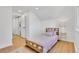 Cozy bedroom with clean white walls, light wood floors, and a single bed at 2725 S Monroe St, Denver, CO 80210