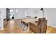 Bright living room featuring hardwood floors, ample natural light, modern furniture, and stylish decor at 2725 S Monroe St, Denver, CO 80210